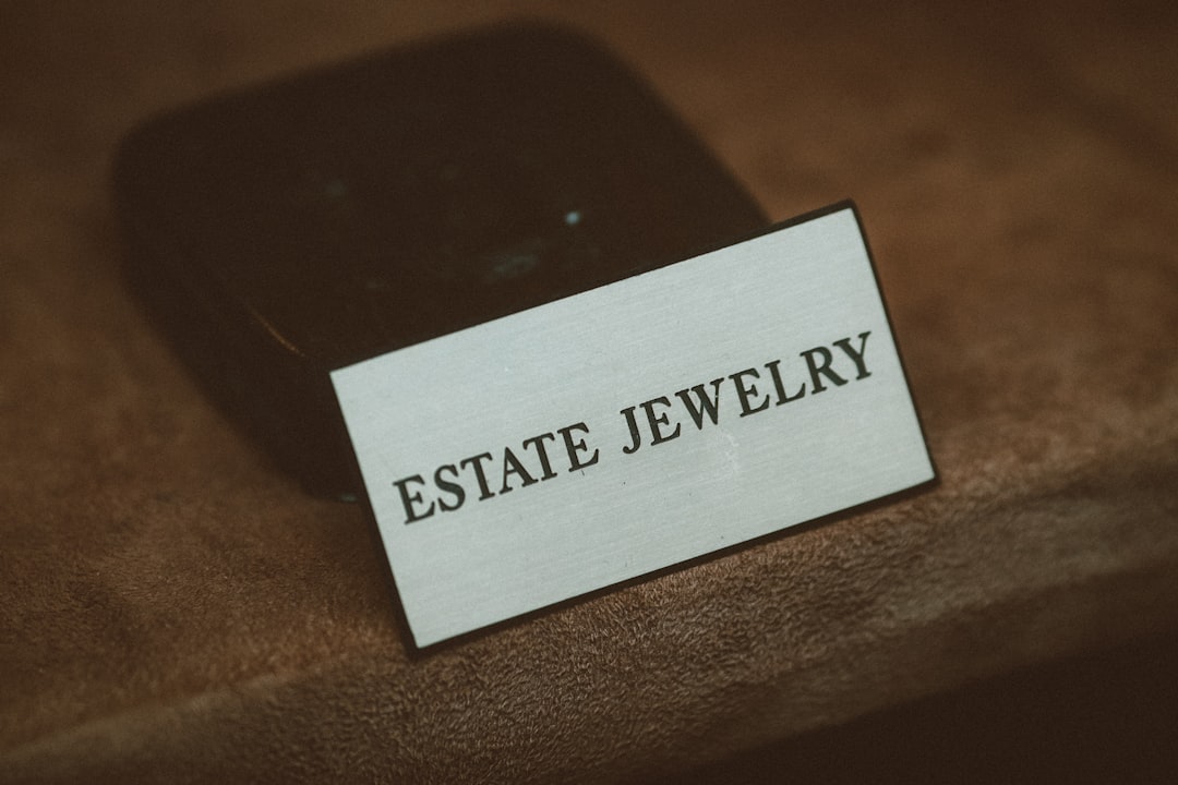 a cell phone sitting on top of a wooden table real estate agent, mobile phone, using app