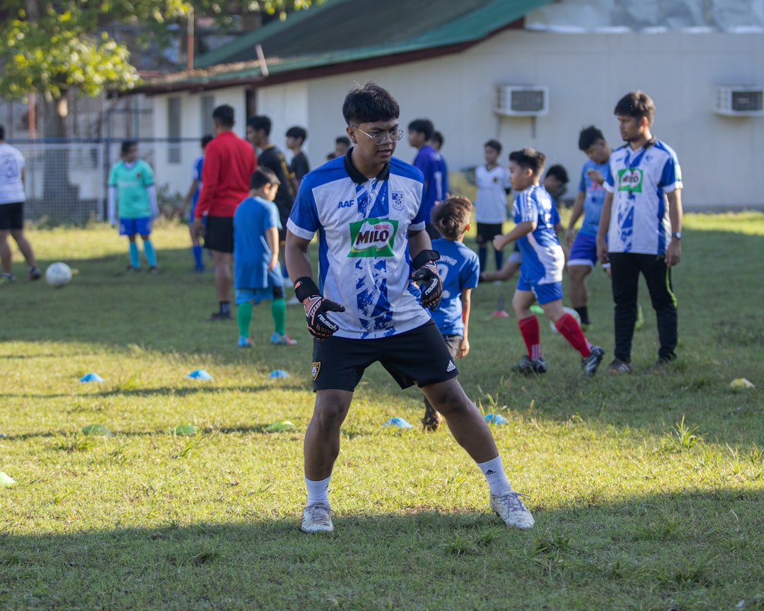 a group of young men playing a game of soccer soccer training coach player
