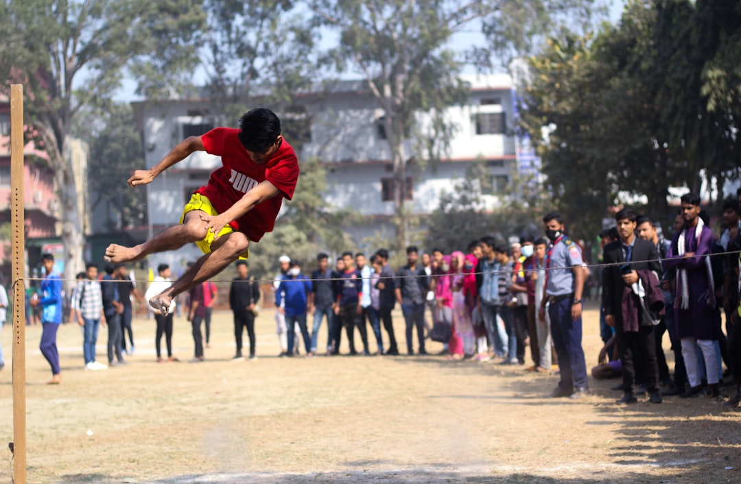 a man flying through the air while riding a skateboard football catch, touchdown, players jumping