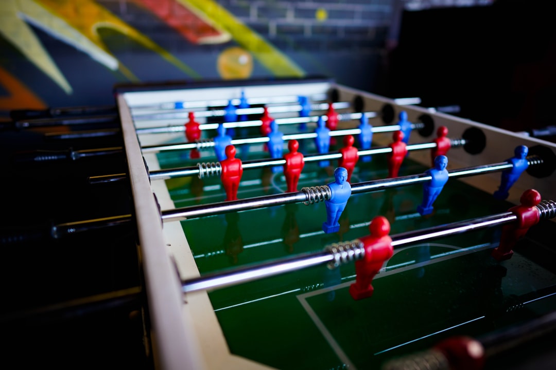 assorted color Foosball table football management, strategy, gaming