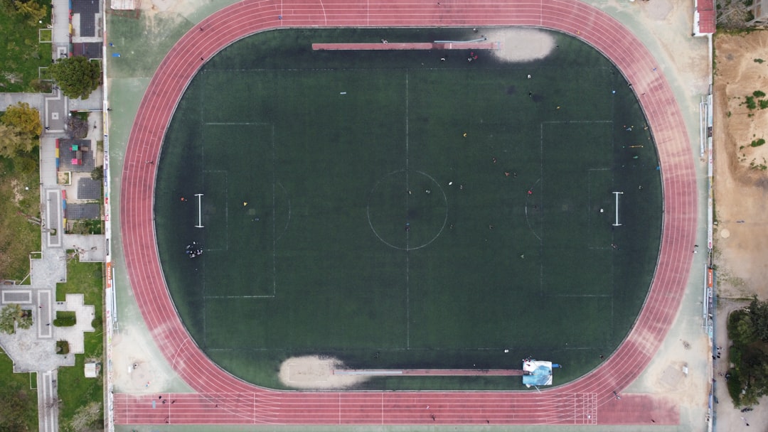 green and red rubber band football field red zone