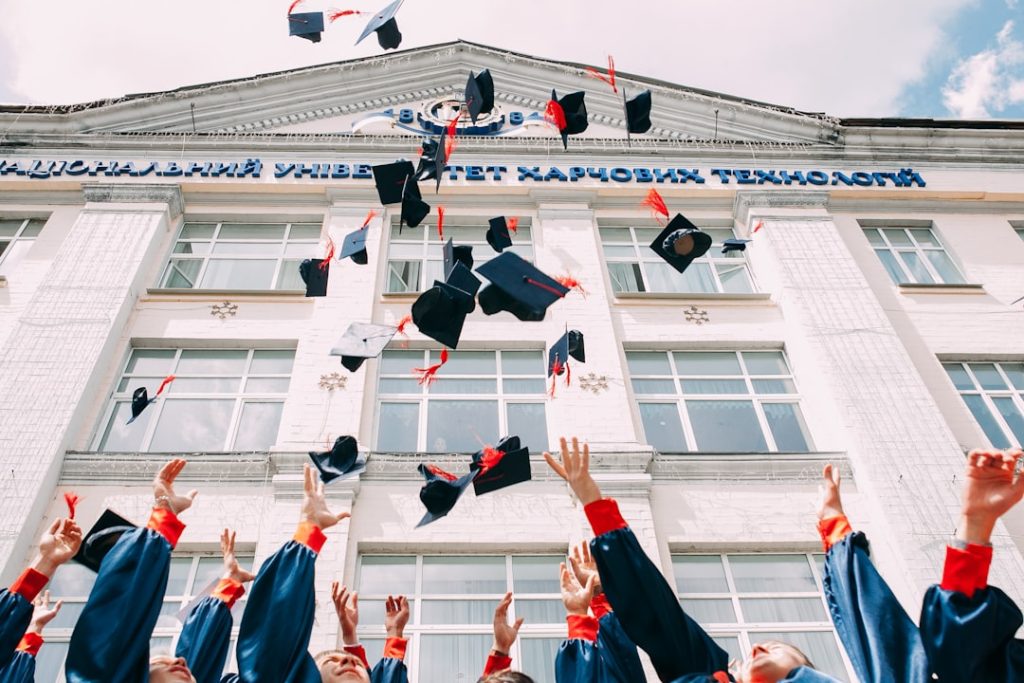 group of fresh graduates students throwing their academic hat in the air middle school baseball glove, youth sports equipment, kids baseball leather