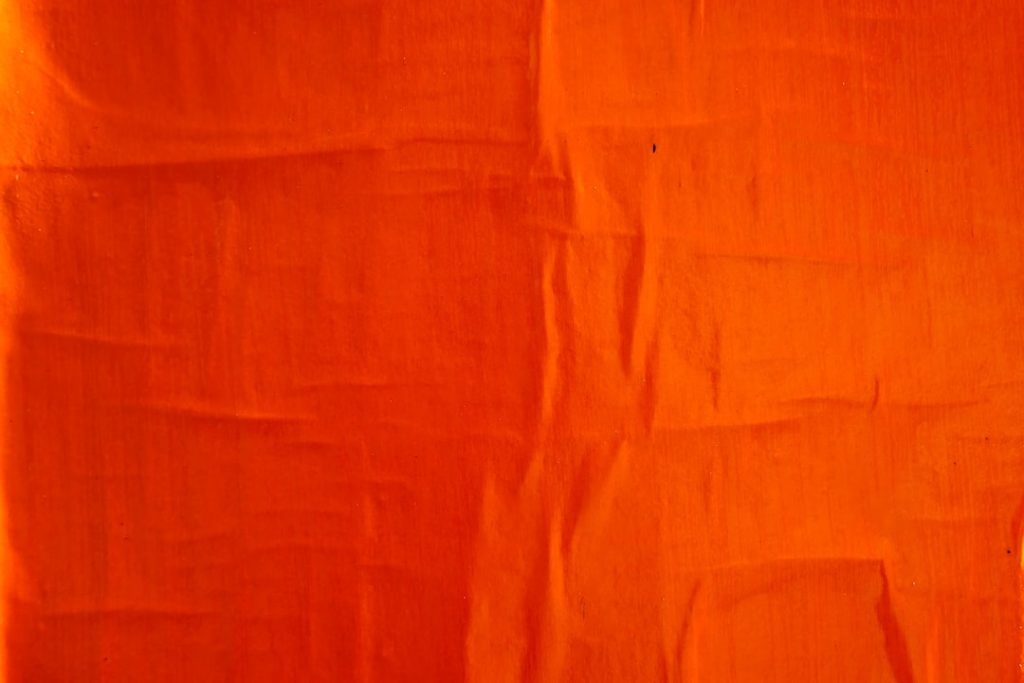 orange textile on white textile football field red zone