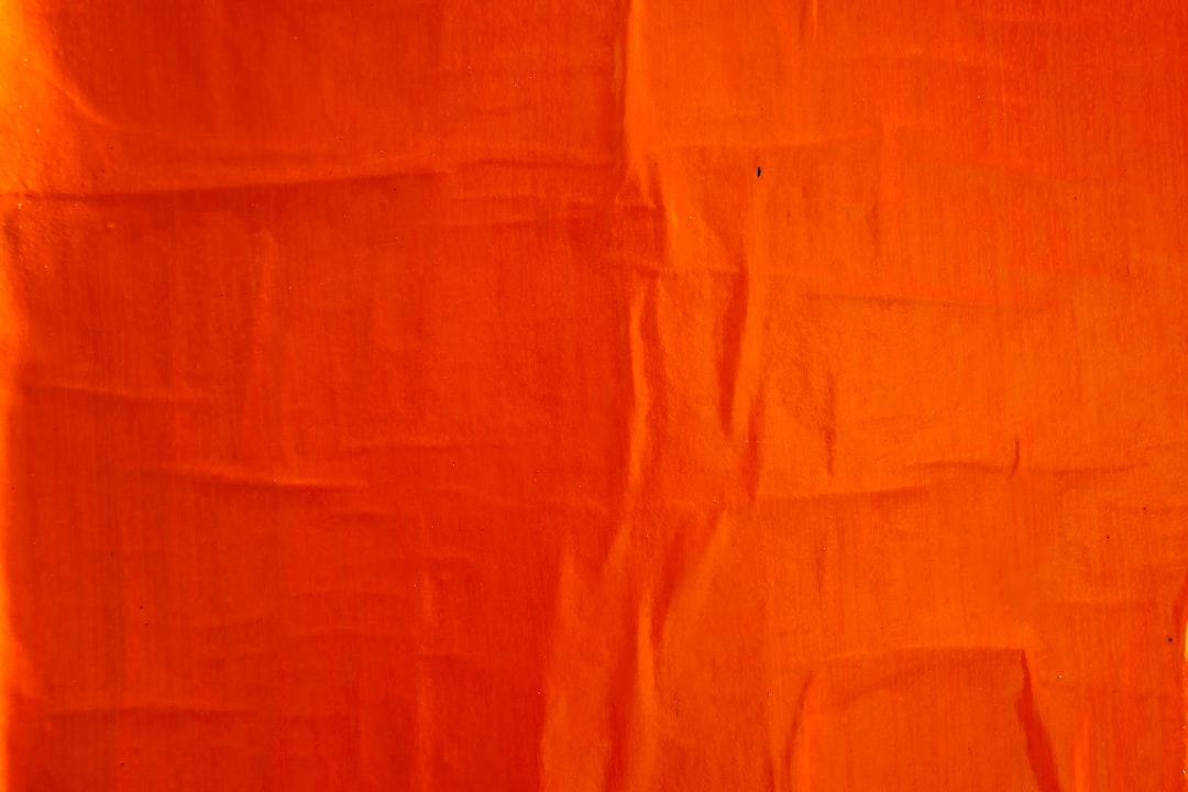 orange textile on white textile football field red zone