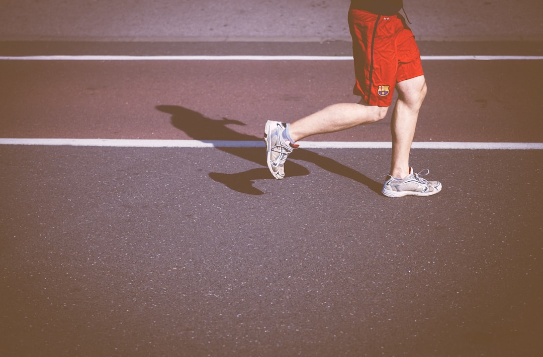 person running on concrete road running back touchdown