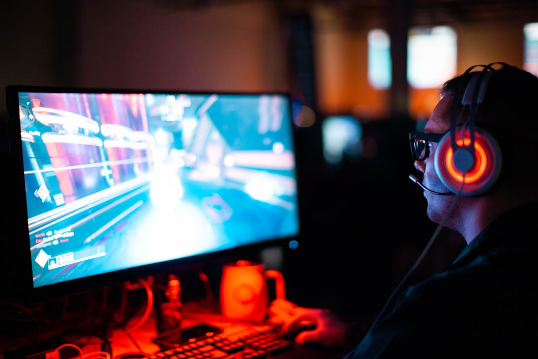 person using computer playing FPS game american football game, stadium lights, referee whistle
