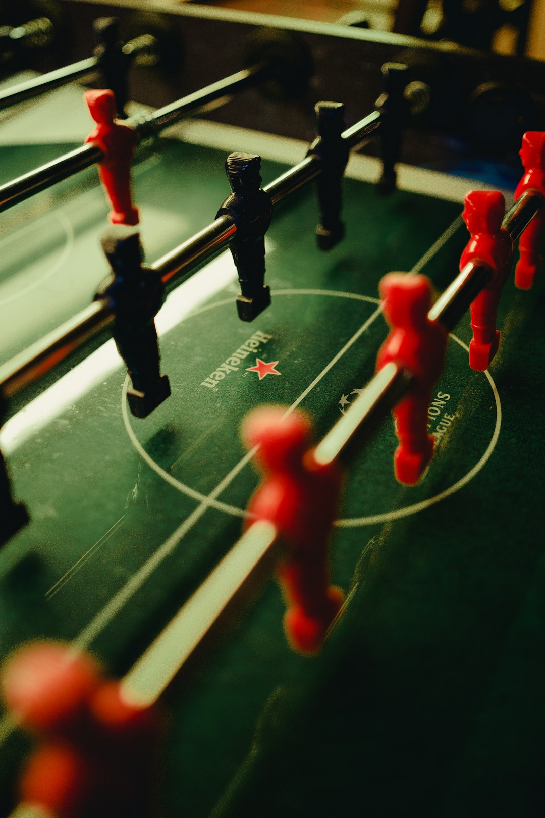 selective focus photograph of foosball table football management, strategy, gaming