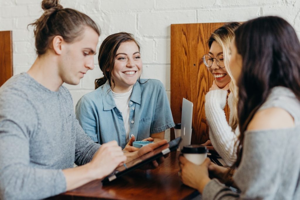 A group of friends at a coffee shop basketball game team huddle