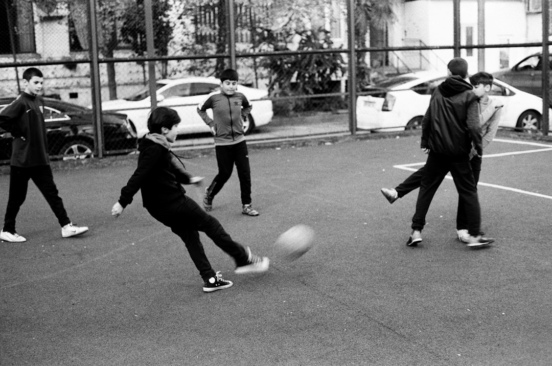 a group of young men playing a game of soccer young players,street football,training session