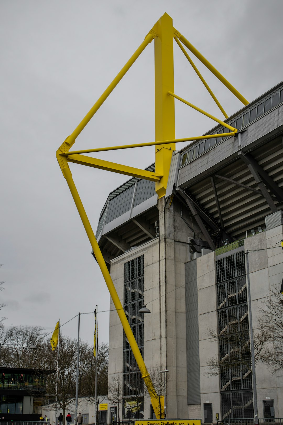 a large metal structure in front of a building jude bellingham, borussia dortmund, football match