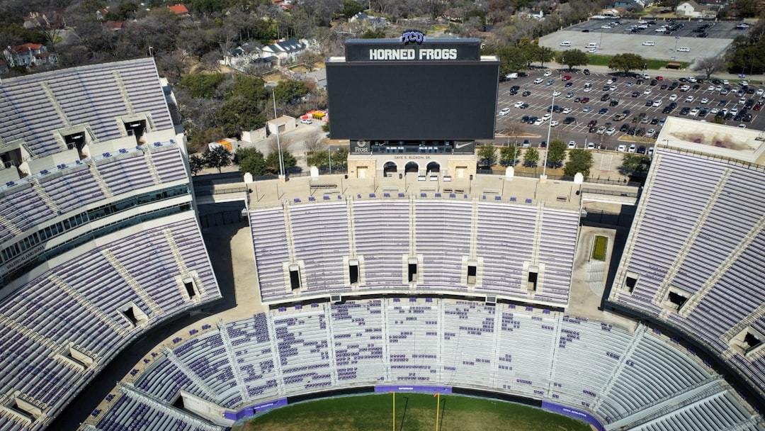 an aerial view of a stadium with a large screen nfl mobile tickets, stadium entrance, ticket scanning
