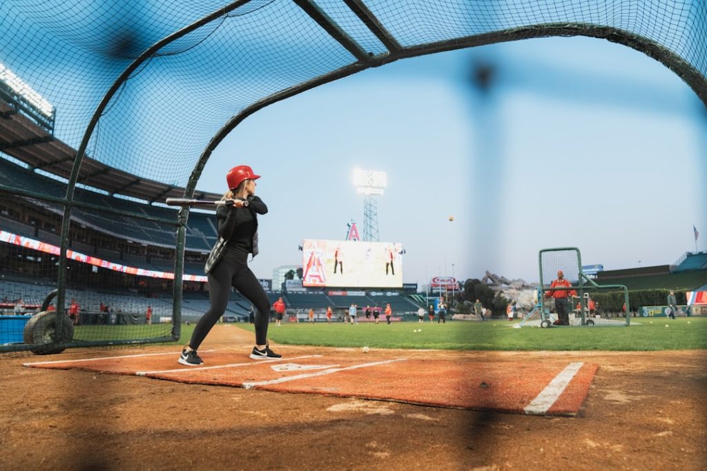 female baseball player about to hit the ball at the field baseball hitter batting swing stadium