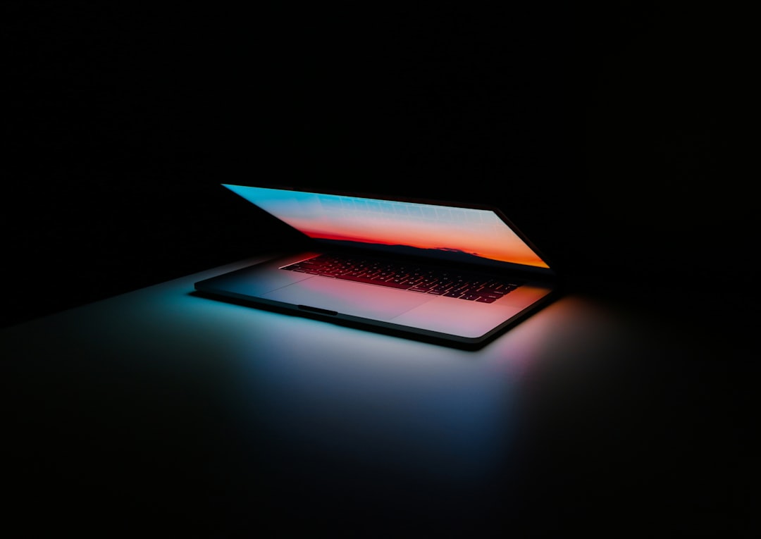 gray and black laptop computer on surface casino software, gaming technology, online casino