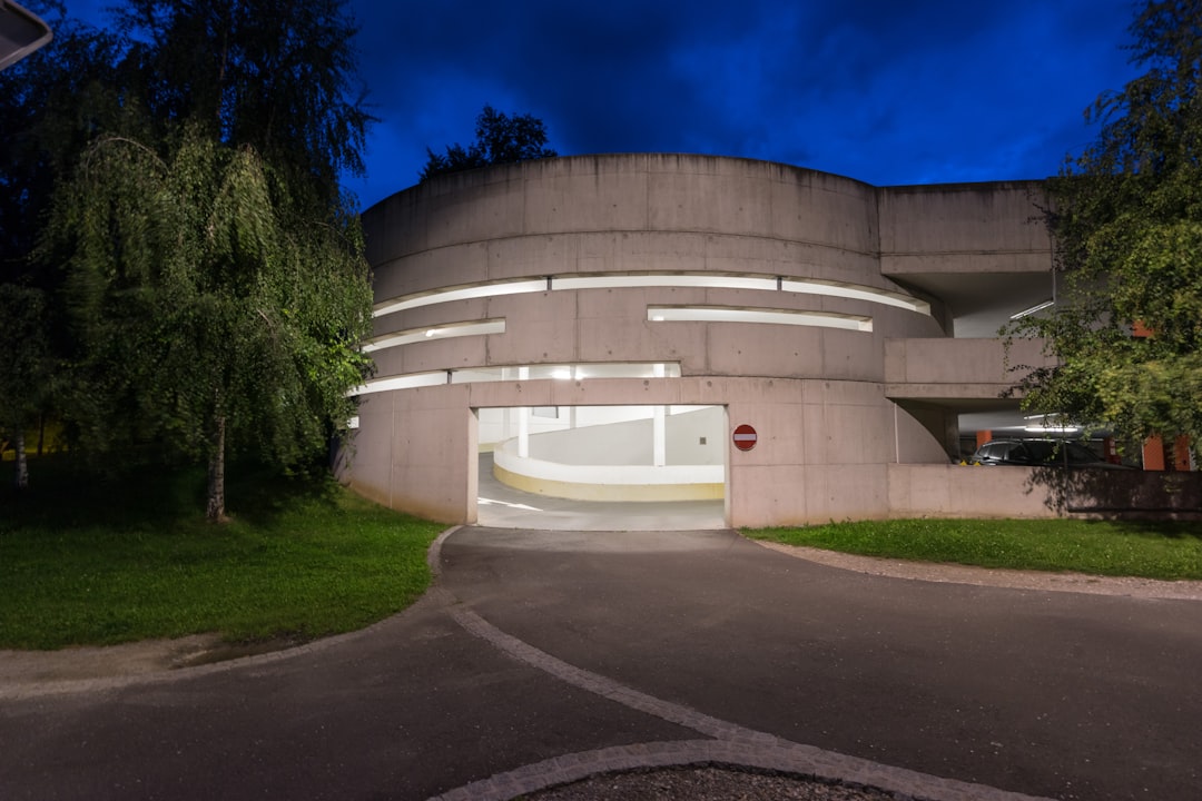 photography of gray concrete building at night time nfl mobile tickets, stadium entrance, ticket scanning