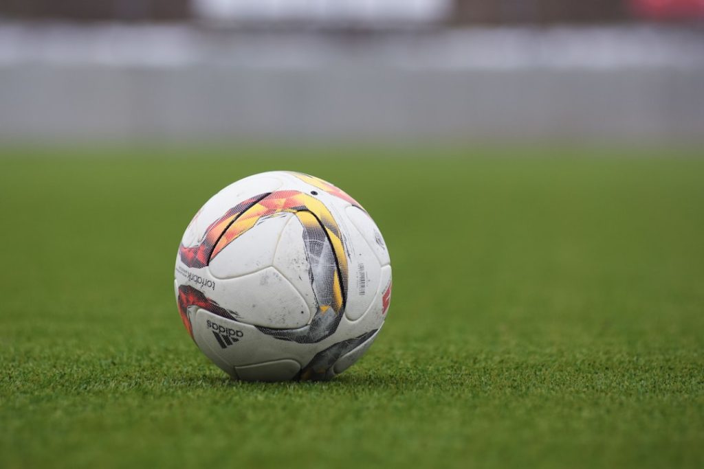 white and gray Adidas soccerball on lawn grass football streaming live,soccer tv hd,hesgoal android
