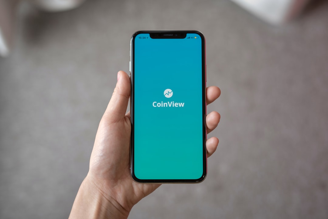 person holding space gray iPhone X cricket match streaming mobile