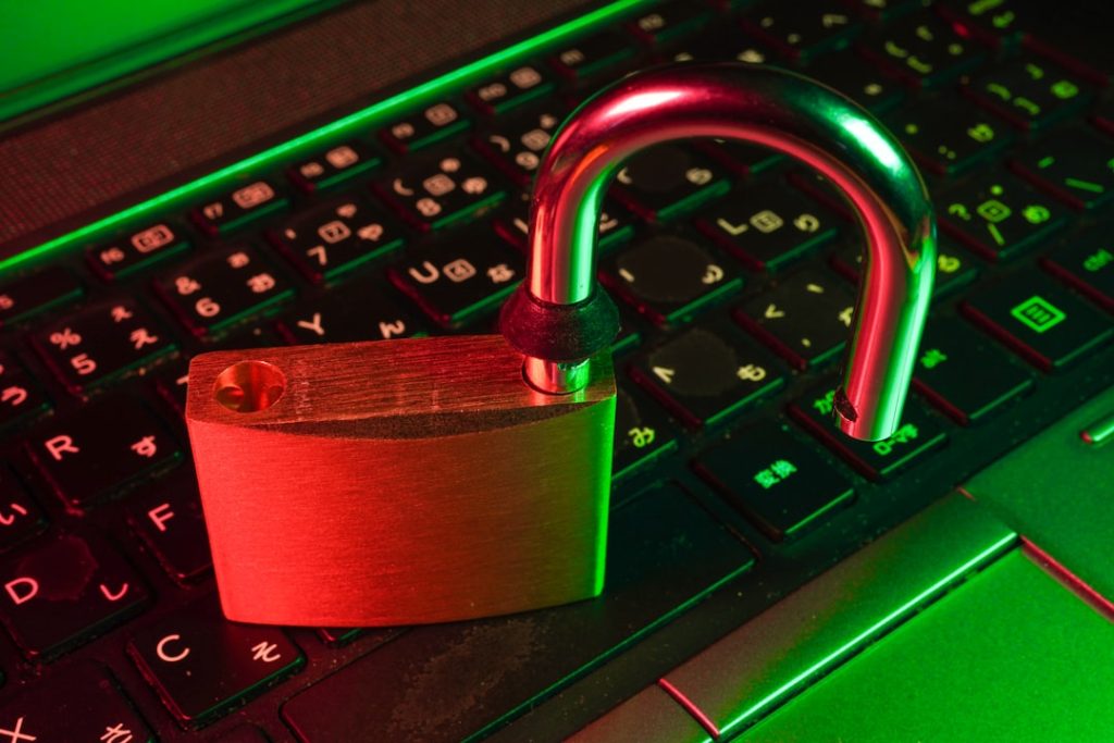 red padlock on black computer keyboard vpn software, online privacy, laptop security