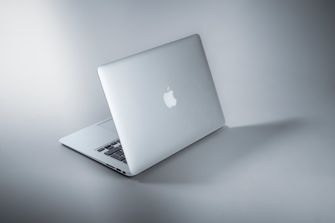 silver macbook on white table vpn software, online privacy, laptop security