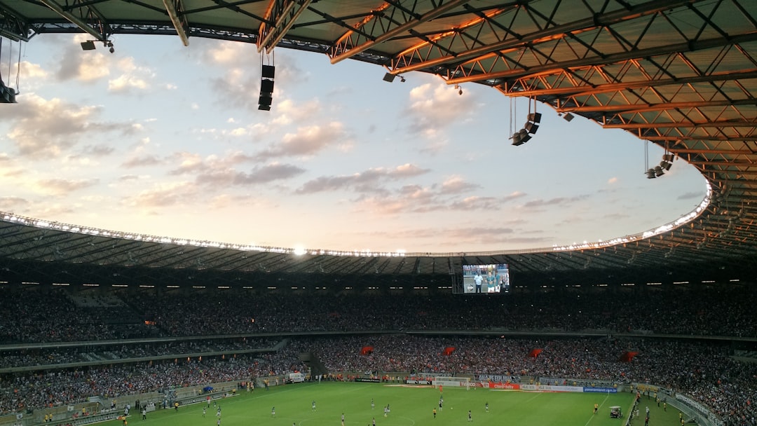 soccer stadium during daytime arena football, indoor stadium, intense game