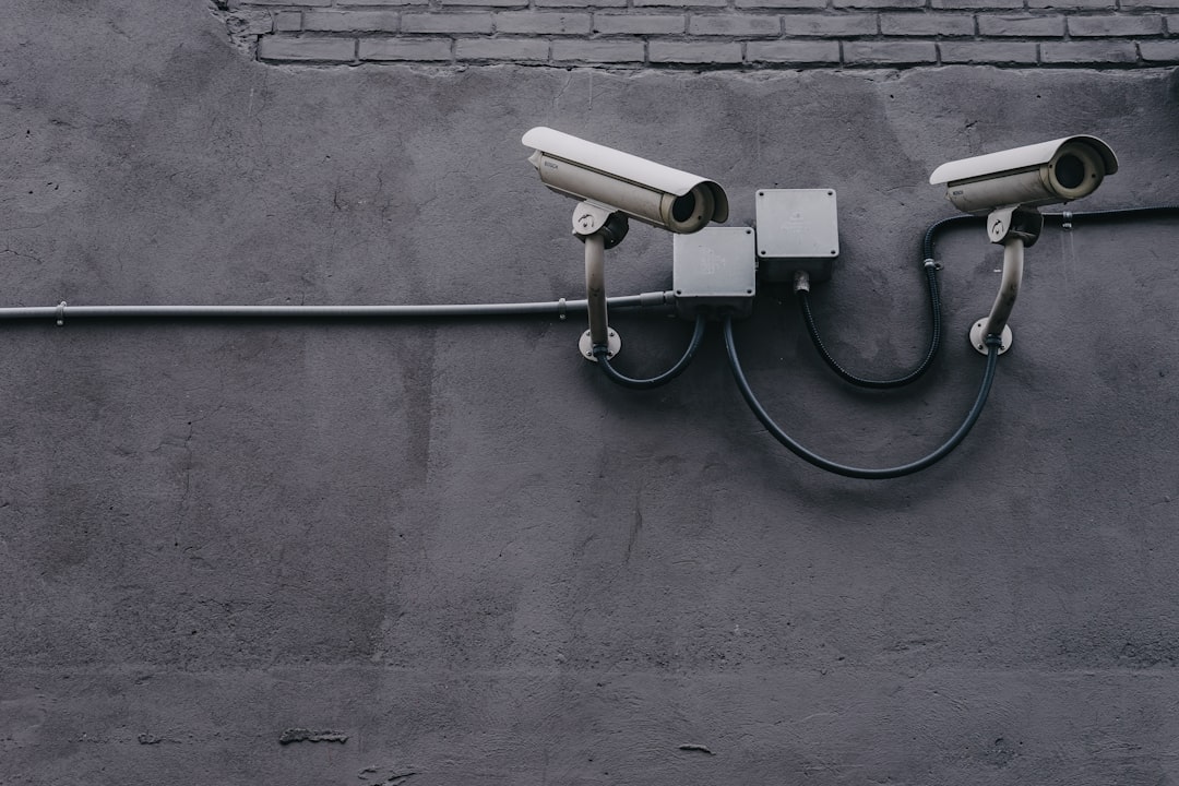 two bullet surveillance cameras attached on wall vpn software, online privacy, laptop security