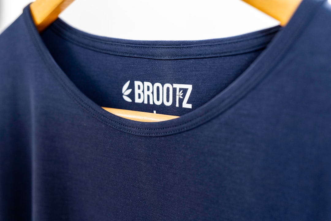 a close up of a black hat custom football shirt finished jersey number name