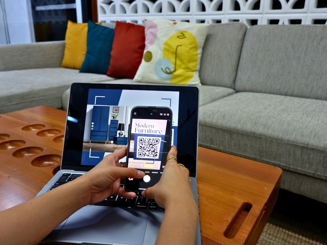 a person using a laptop computer with a qr code on the screen real estate paperwork, mobile screen, crm app