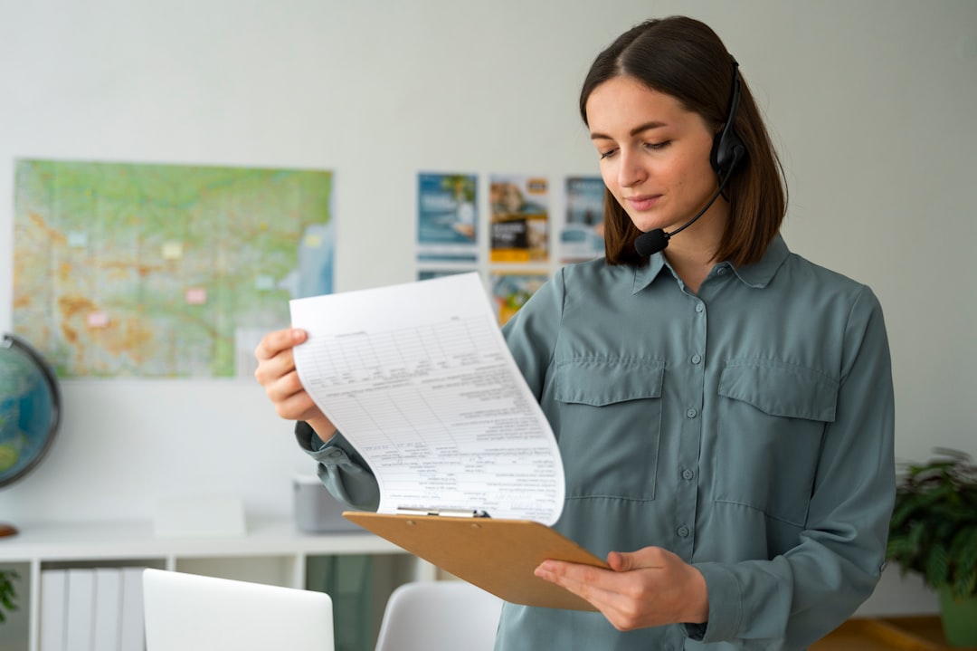 A woman holding a piece of paper in her hands real estate paperwork, mobile screen, crm app