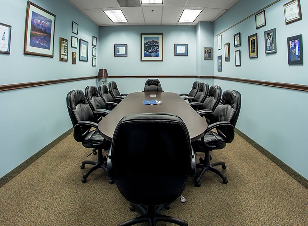 black office rolling chairs on brown carpet cowboys draft room, nfl 2025, team office