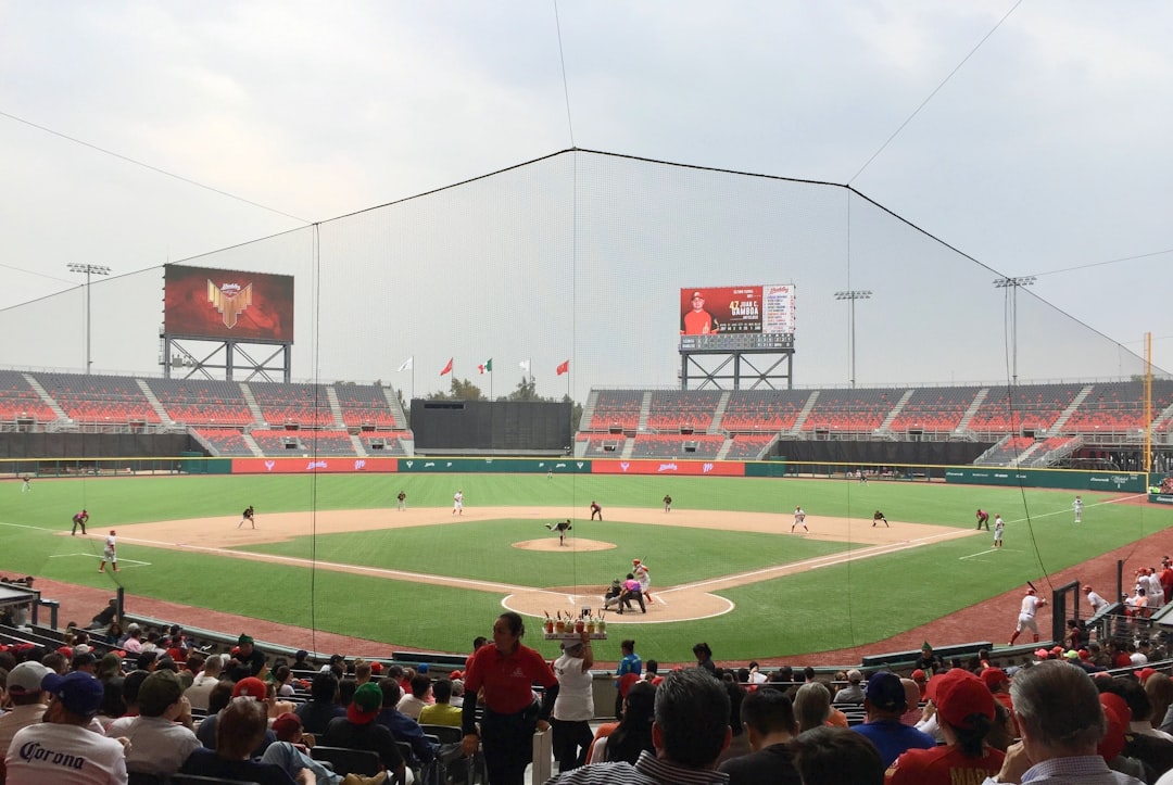 a baseball game is being played on a cloudy day baseball team celebration game stadium
