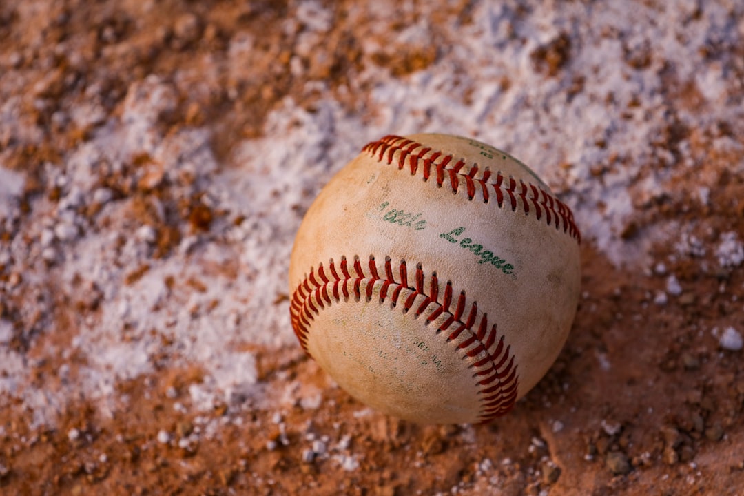 a baseball on the ground college baseball, mlb the show 25, stadiums