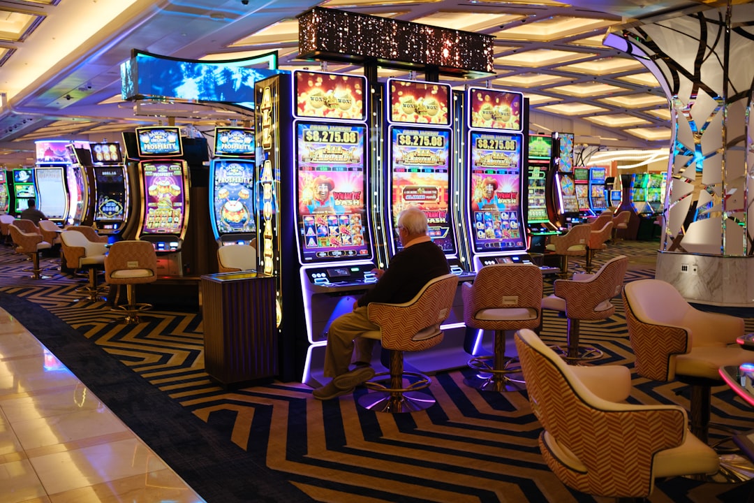 a casino room filled with lots of slot machines mobile gaming, casino slots, online entertainment