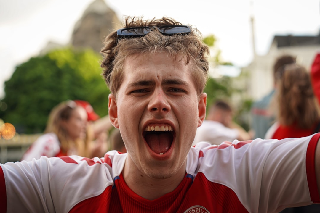 a man with his mouth open and sunglasses on jude bellingham, england football team, celebrating goal