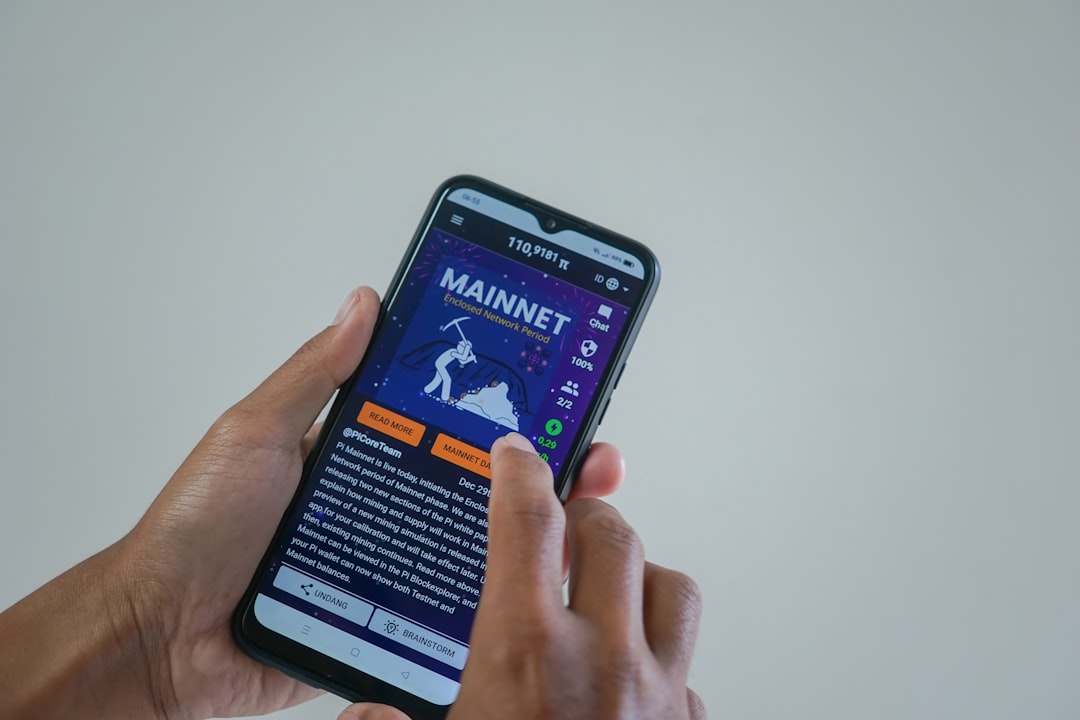 a person holding a cell phone with a website on the screen fantasy sports, player stats, prize picks app