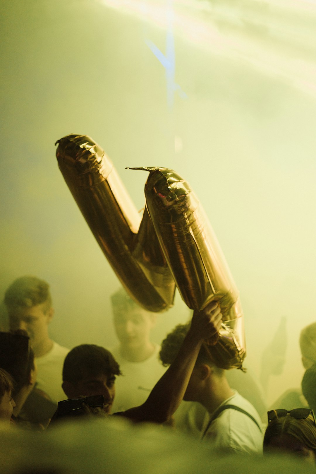 a person holding a guitar premier league, football trophy, players celebrating