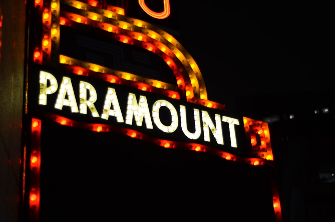 a sign that is lit up in the dark paramount plus, streaming service, movie night
