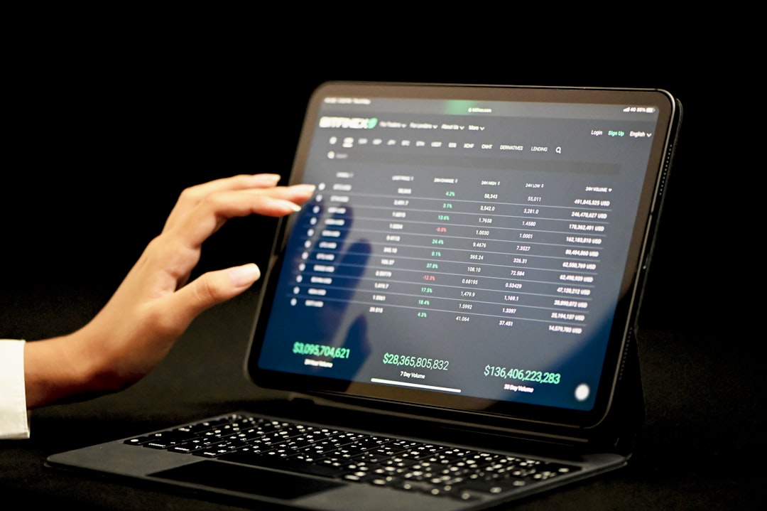 black laptop computer turned on displaying blue screen betting exchange, betting screen, sports market