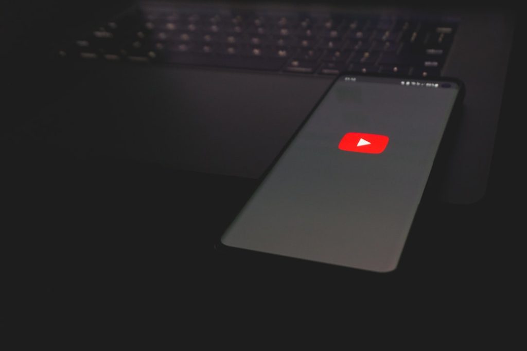 black laptop computer turned on with red light blocked content, streaming error, location restriction