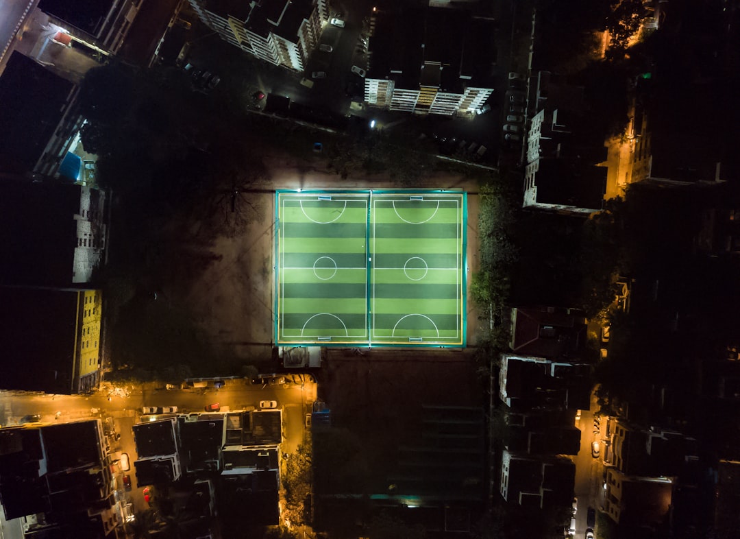 high angle photo of soccer field touchdown celebration, 8 bit football fan, pixel art stadium