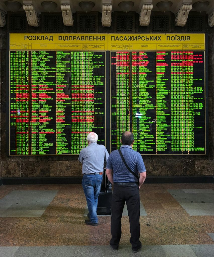 man in blue denim jacket standing beside man in gray jacket betting exchange, betting screen, sports market