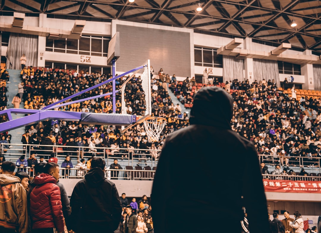 silhoutte of man watching basketball spokane basketball, gonzaga crowd, hoopfest event