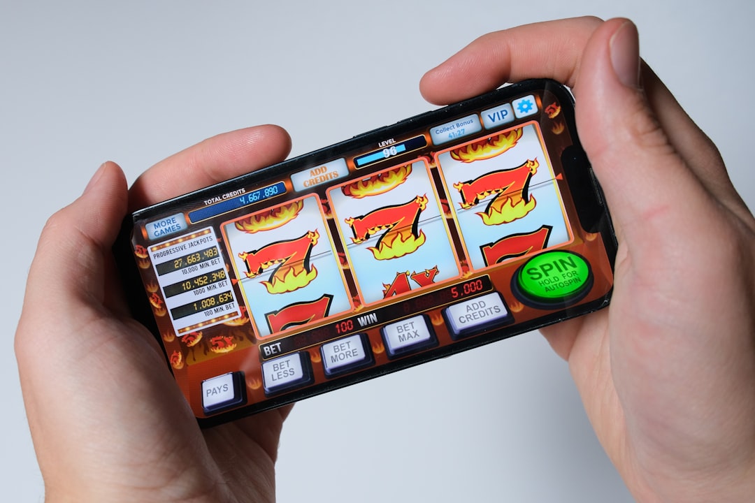 Someone is playing a mobile slot machine game. mobile gaming, casino slots, online entertainment