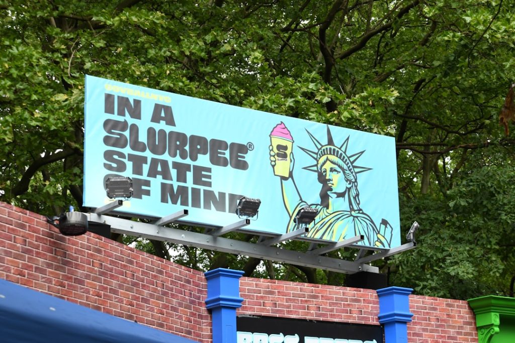A 7 eleven billboard promoting slurpees. long island map, political outreach, campaign signs