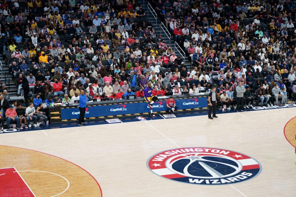 a crowd of people watching a basketball game nba players stats analysis chart