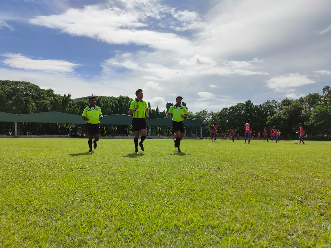a group of people on a field professional soccer training, rondo, elite team