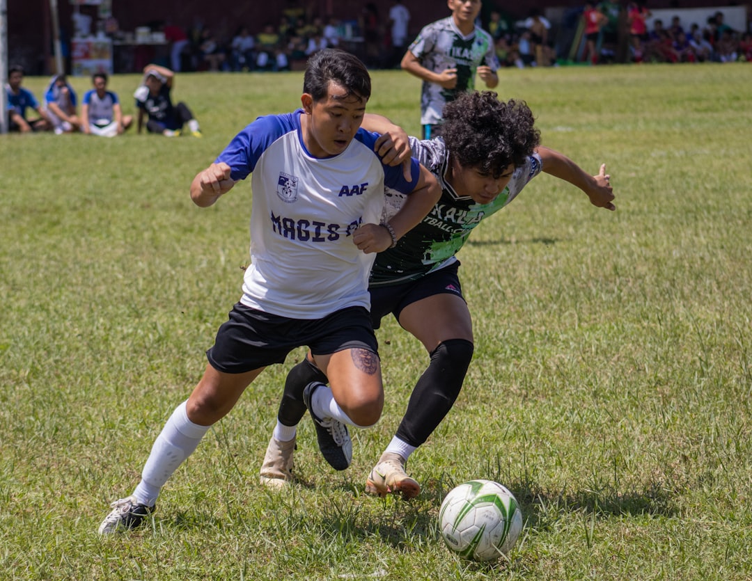 a group of young people playing a game of soccer through ball, forward pass, defense split, soccer pass