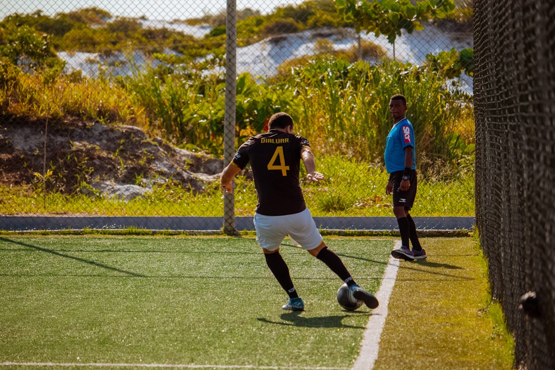 a person playing football ronaldo messi football rivalry
