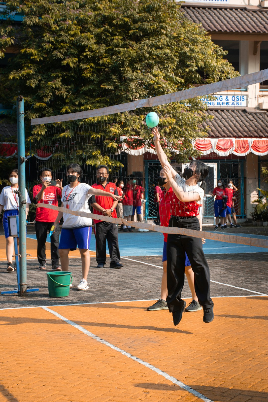 a person playing volleyball volleyball jump, gym practice, youth sports