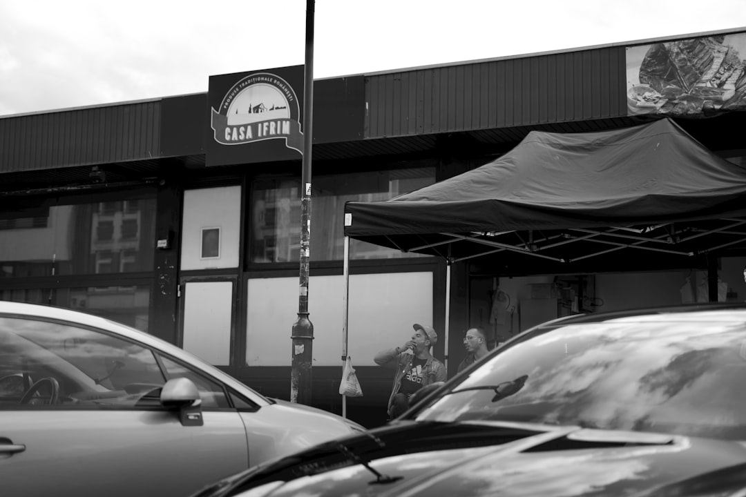 black car parked near store community event, local business, auto service booth