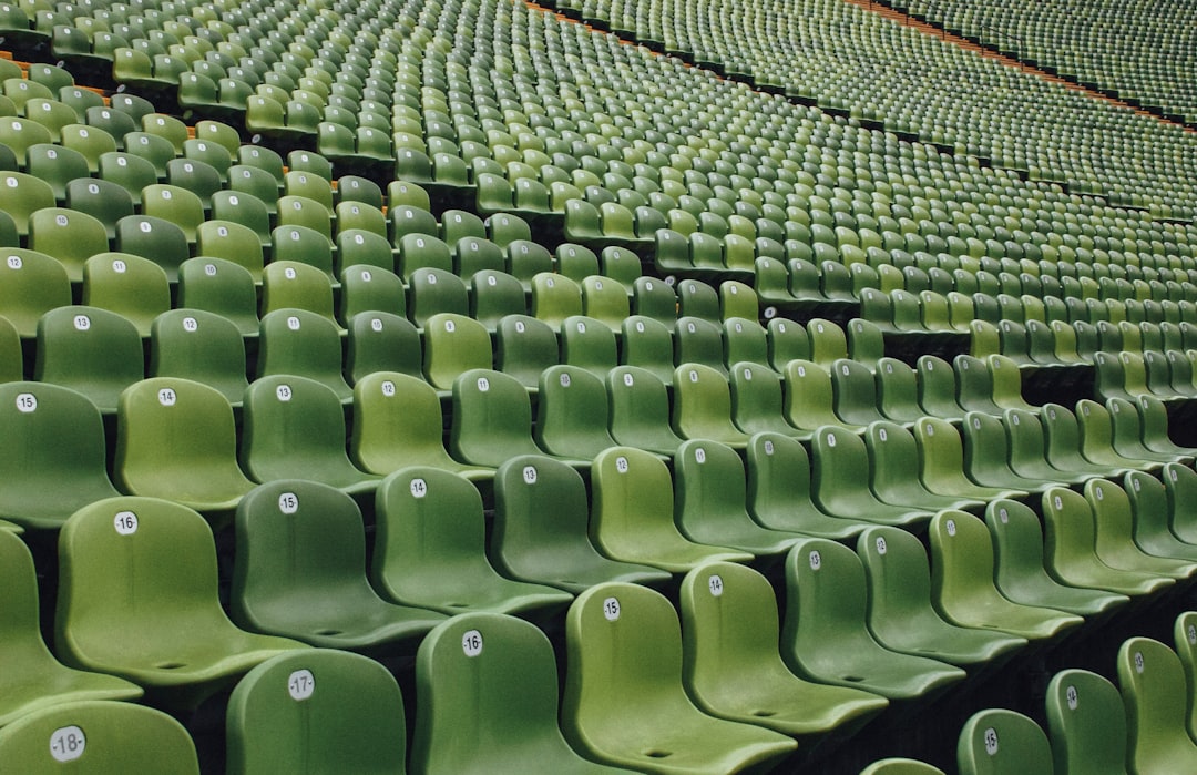 green and black metal chairs english football stadium, matchday fans, league table