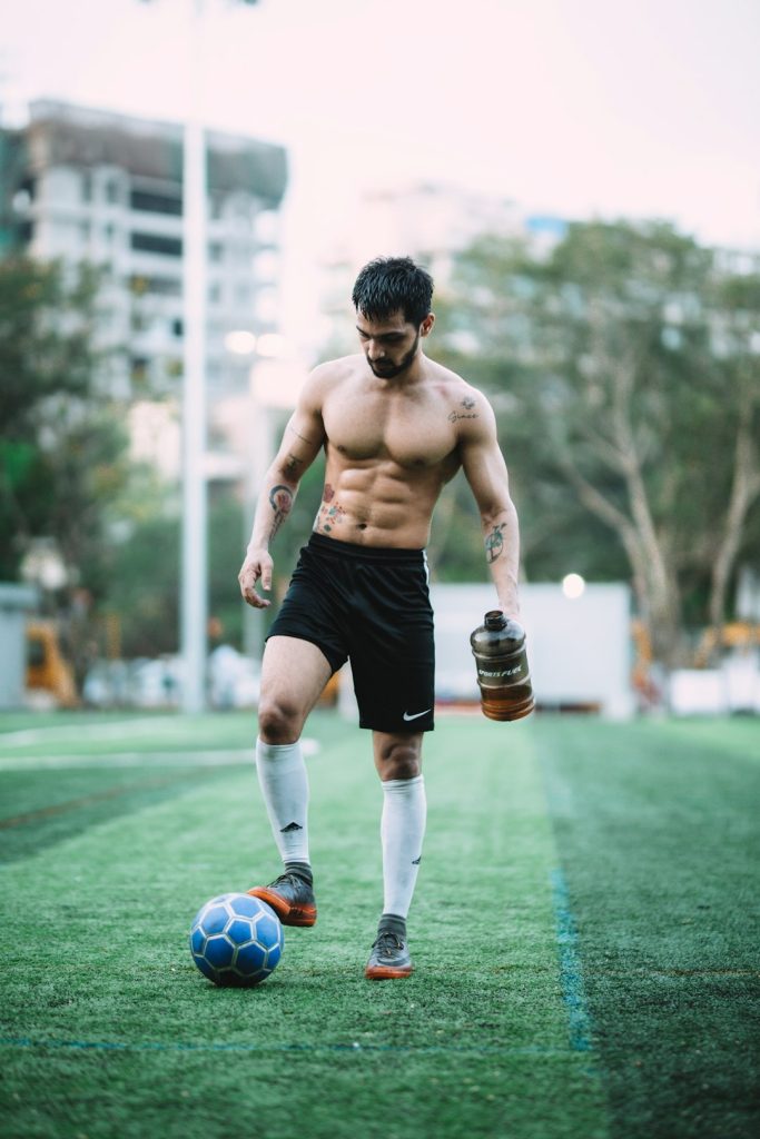 man playing soccer ball during daytime custom jersey soccer fan